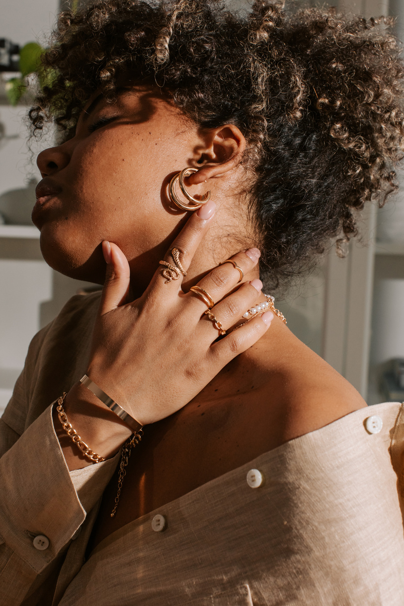 Woman Wearing Gold Jewelry